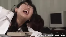 Slutty Japanese office lady is hotly spanking bubble butt chick on her desk