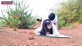 Asian girl is standing in doggy pose wearing black mask and being hotly fucked